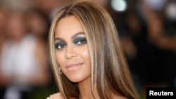 FILE - Singer-Songwriter Beyonce Knowles arrives at the Metropolitan Museum of Art Costume Institute Gala (Met Gala) to celebrate the opening of "Manus x Machina: Fashion in an Age of Technology" in the Manhattan borough of New York.