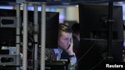 A trader works on the floor at the New York Stock Exchange in New York, Nov. 20, 2018.