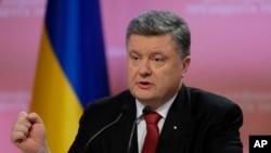 Ukrainian President Petro Poroshenko gestures during a press conference in Kyiv, Ukraine, Dec 29, 2014.