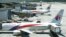 FILE - Malaysia Airlines aircraft are seen at Kuala Lumpur International Airport in Sepang, March 25, 2014.