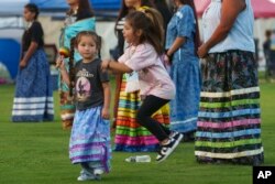 FILE - Children play at the annual San Manuel Pow Wow in San Bernardino, California, on Sept. 15, 2023.