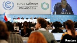 Para perunding pada pertemuan iklim PBB atau COP24 di Katowice, Polandia, Kamis (13/12).