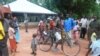 South Sudanese gather in front of the Zereda center, which increases awareness of HIV, in Western Equatoria state.