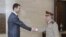 Syria's President Bashar al-Assad (L) welcomes new Chief of General Staff of the Army and the Armed Forces, General Ali Abdullah Ayyoub, before a meeting in Damascus, July 22, 2012. 