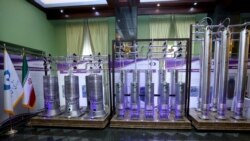 FILE - A number of new-generation Iranian centrifuges are seen on display during Iran's National Nuclear Energy Day in Tehran, Iran, April 10, 2021.