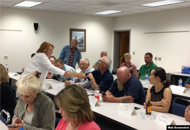 Democratic Sen. Heidi Heitkamp of North Dakota, left, in white, spoke recently to Valley City farmers and small-business owners at an economic roundtable.