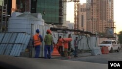 FILE: Foreign laborers in Doha. There are about 1.4 million foreign laborers in Qatar. Taken December 9,. 2014