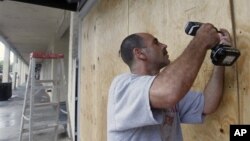 An anti-government protester gives a rose to a Thai soldier at the Defense Ministry during a rally in Bangkok.
