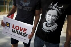 FILE - A man wears a T-shirt showing U.S. Supreme Court Justice Ruth Bader Ginsburg as "Notorious R.B.G." at a celebration rally in West Hollywood, Calif., June 26, 2015. The U.S. Supreme Court had ruled that the U.S. Constitution provides same-sex couple