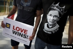FILE - A man wears a T-shirt showing U.S. Supreme Court Justice Ruth Bader Ginsburg as "Notorious R.B.G." at a celebration rally in West Hollywood, Calif., June 26, 2015. The U.S. Supreme Court had ruled that the U.S. Constitution provides same-sex couple