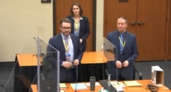 In this image taken from video, defense attorney Eric Nelson, L, defendant former Minneapolis police officer Derek Chauvin, R, are seen during jury selection at the Hennepin County Courthouse in Minneapolis, March 22, 2021.