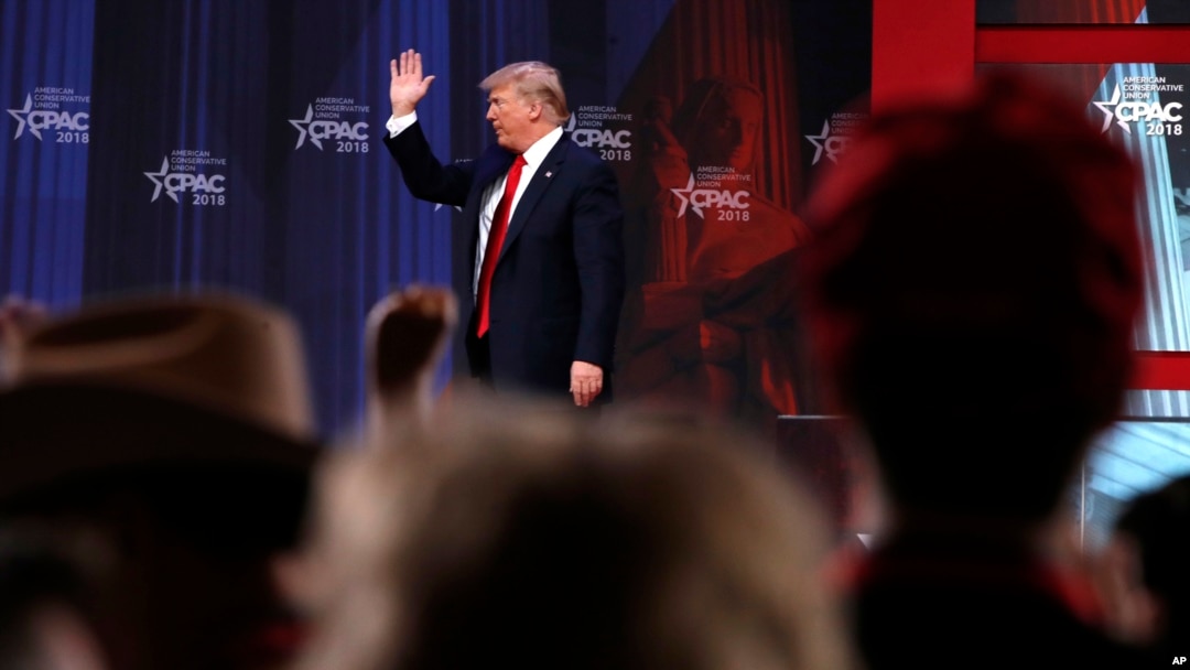 President Donald Trump waves after speaking to the Conservative Political Action Conference (CPAC), at National Harbor, Md., Feb. 23, 2018.