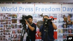 Thai video journalists working at Thai Journalists Association during the International World Press Freedom Day before a press conference in Bangkok, Thailand, May 3, 2017.