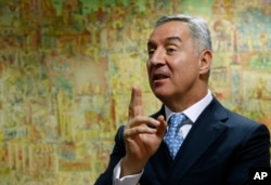 Montenegro's former Prime Minister Milo Djukanovic speaks during an interview with The Associated Press, in Podgorica, Montenegro, March 14, 2017.