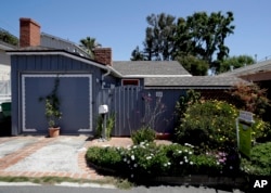 This tiny cottage on Lombardy Lane in Laguna Beach, Calif. is for sale at just shy of $1 millions is shown Friday, May 25, 2018. This one bedroom home is 595 square feet and is a few blocks from the ocean. (AP Photo/Chris Carlson)