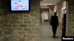 A staffer of the NATO Cooperative Cyber Defense Center of Excellence walks in the center in Tallinn, Estonia.