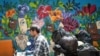 Trash is removed from Ouzville. The graffiti project is an adaption of an original plan to make art from rubbish left over during Lebanon's 2015 trash crisis.
(J. Owens for VOA)