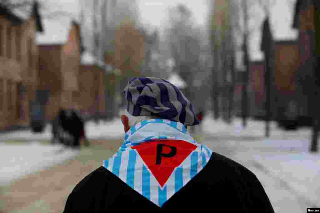 A survivor is seen at the former Nazi German concentration and extermination camp Auschwitz, as he attends ceremonies marking the 74th anniversary of the liberation of the camp and International Holocaust Victims Remembrance Day, in Oswiecim, Poland.