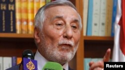 FILE - Bahjat Suleiman, Syrian ambassador to Jordan, gestures during a news conference at the Syrian embassy in Amman, May 22, 2013. 