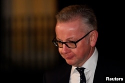 Britain's Environment Secretary, Michael Gove, leaves 10 Downing Street, in London, Britain, Nov. 14, 2018.