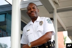 FILE - The Ferguson Police Department has a new black police chief, Delrish Moss, pictured May 9, 2016. It is also required to implement a new officer training program.
