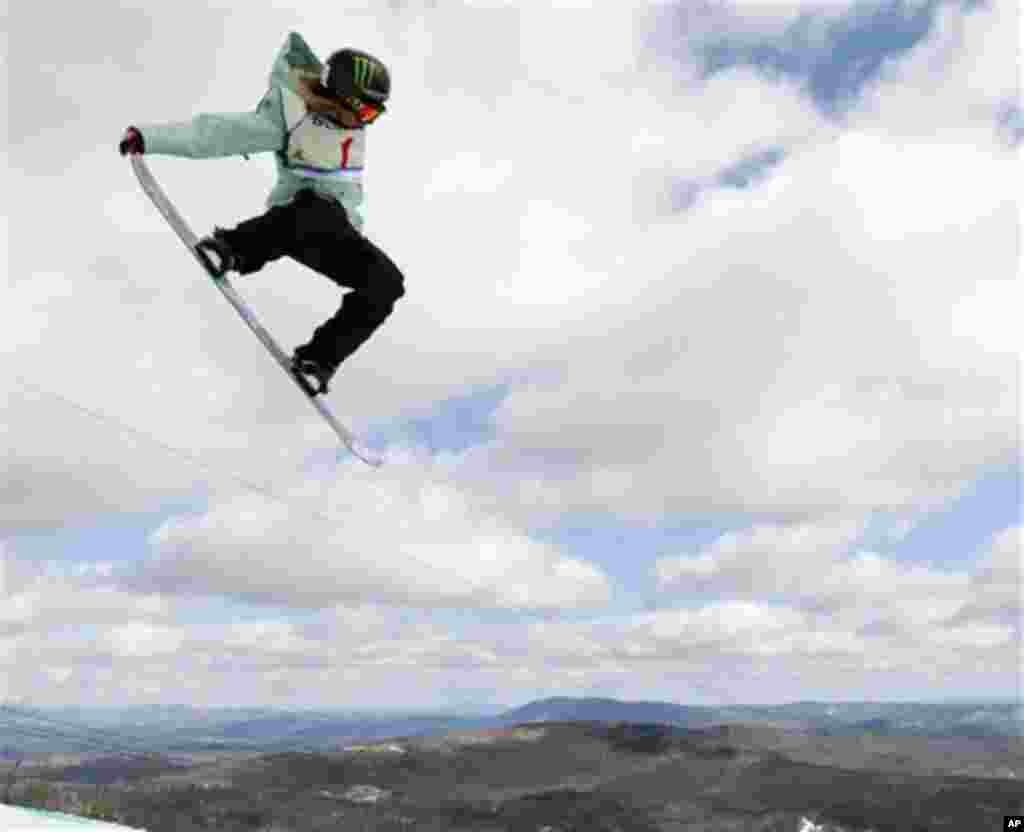 Finland's Enni Rukajarvi competes in the women's slopestyle finals at the U.S. Open Snowboarding Championships in Stratton, Vt., on Friday, March 9, 2012. Rukajarvi finished in third place. (AP Photo/Mike Groll)