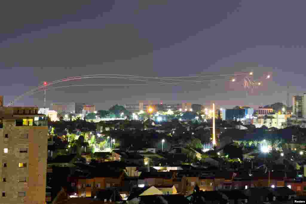 Iron Dome anti-missile system fires interception missiles as rockets are launched from Gaza towards Israel, as seen from the city of Ashkelon.