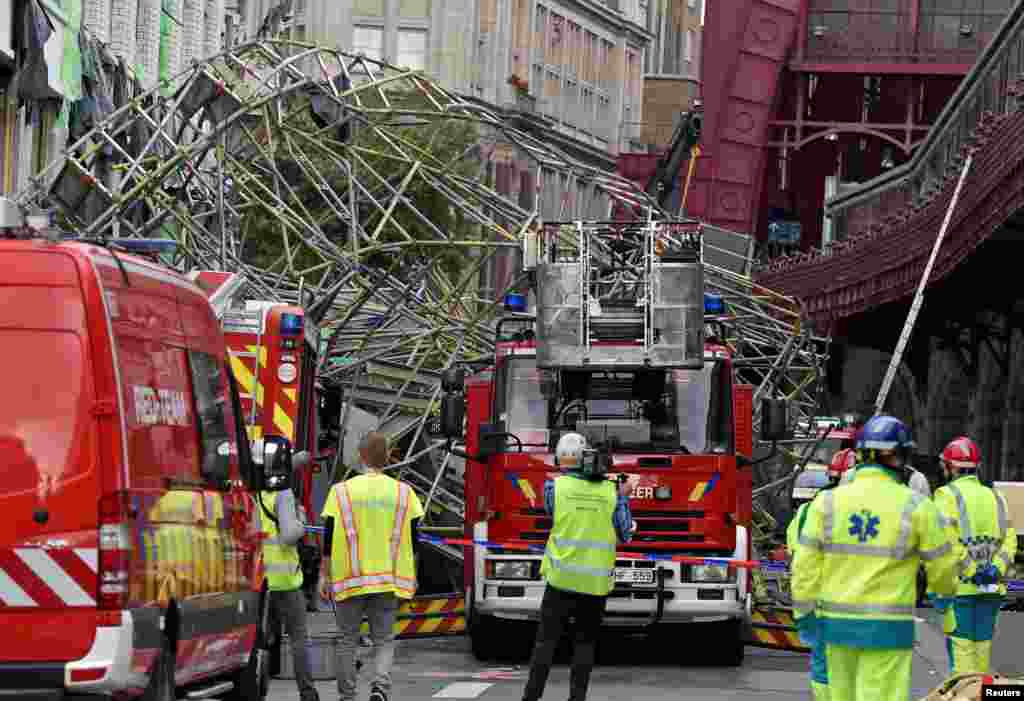 Rescue personnel are seen at the scene of a scaffolding collapse in Antwerp, Belgium.