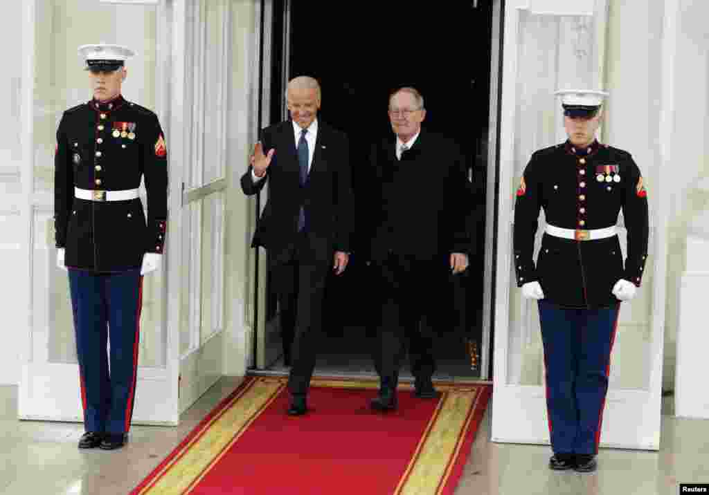 U.S. Vice President Joseph Biden (L) departs the White House with Senator Lamar Alexander (R-TN) in Washington January 21, 2013