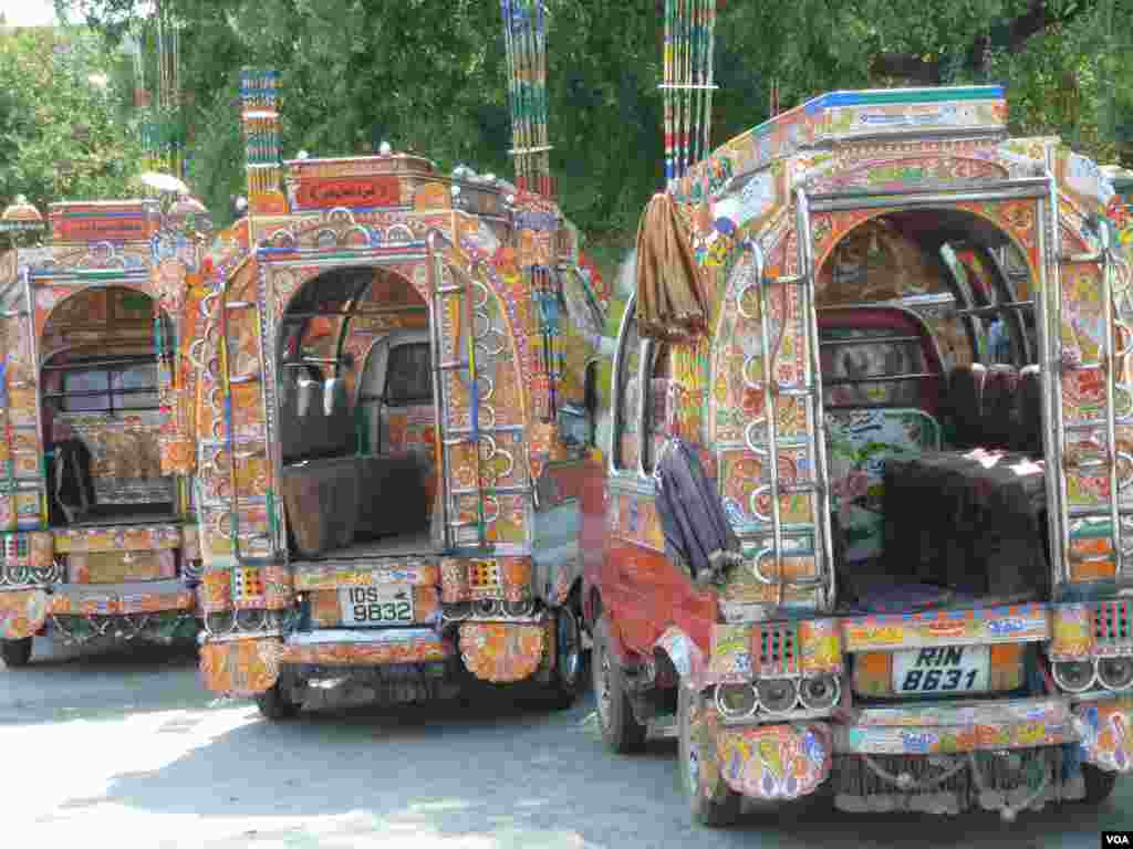 Heavily-painted small buses, Islamabad, Pakistan, July 10, 2012. (S. Gul/VOA)