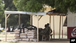 Nigeria troops man a checkpoint in Maiduguri, Nigeria, Sept, 28, 2011.