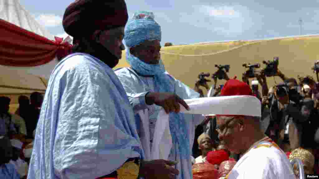 Traditional chiefs help prepare a turban head dress during the turbaning ceremony of former Nigerian defence minister and oil magnate General Theophilus Danjuma in Zaria, Kaduna State.