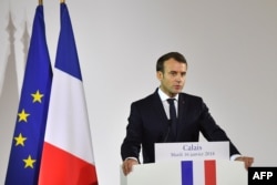 FILE - French President Emmanuel Macron gives a speech in the northern port of Calais on Jan. 16, 2018, vowing that France will not allow another migrant camp like the infamous "Jungle" to spring up in the city.