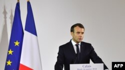 FILE - French President Emmanuel Macron gives a speech in the northern port of Calais, Jan. 16, 2018. 