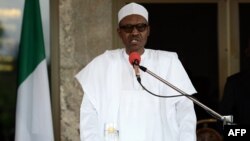 (FILES) This file photo taken on May 14, 2016 shows Nigerian President Muhammadu Buhari speaking during a press conference at the Presidential Palace in Abuja.