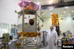 Ofer Doron, head of the Space Division of state-owned Israel Aerospace Industries, the country's biggest defence contractor, looks at a satellite in a clean room at Yahud, Israel Feb. 27, 2017.