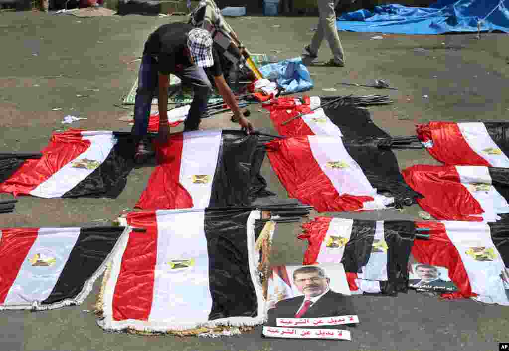 A Morsi supporter arranges flags for sale in Nasr city, Cairo, July 15, 2013.