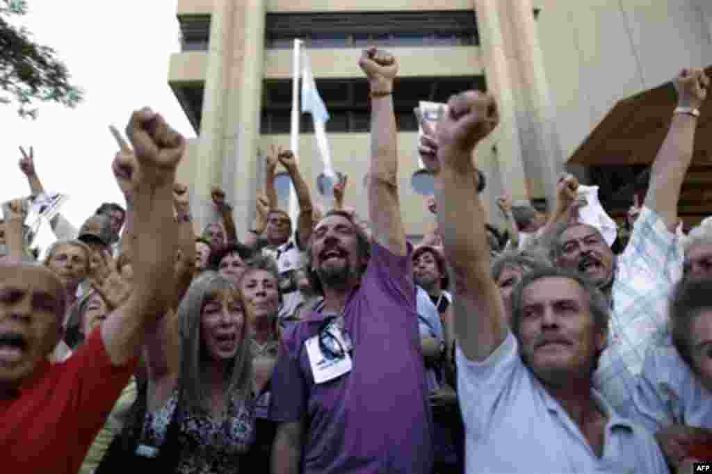 Relatives of victims killed during Argentina's dirty war celebrate the verdict at the end of the trial of former dictator Jorge Videla in Cordoba, Argentina, Wednesday Dec. 22, 2010. Former dictator Jorge Videla was sentenced to life in prison Wednesday