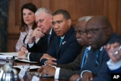 FILE - Leaders and Representatives of Caribbean countries attend a meeting with Britain's Prime Minister Theresa May, Apr. 17, 2018