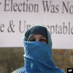 A former legislator marches during a post-election protest in Kabul, 07 Nov 2010