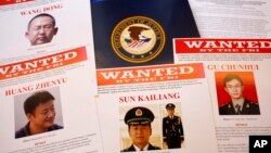 Departemen Kehakiman AS mendakwa beberapa personil militer China dalam jumpa pers hari Senin (19/5).