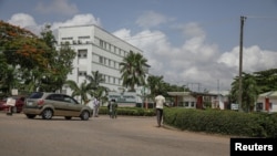 FILE - People are seen going into the National hospital after resident doctors commence a doctors strike, as coronavirus disease (COVID-19) infection continues to rise in Abuja, Nigeria, June 15, 2020. 