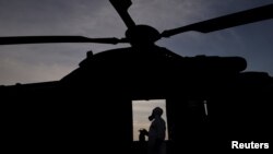 FILE - A Brazilian army forces soldier is pictured as he attends a training against chemical, biological, radiological and nuclear attacks ahead of the Rio 2016 Olympic Games at Rio de Janeiro air base, Brazil, July 15, 2016. 