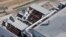 This photo provided by NASA, taken during an aerial survey of the Kennedy Space Center in Florida, shows hurricane damage to a support building, Oct. 8, 2016.