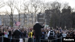 FILE - US Democratic presidential candidate and US Senator Bernie Sanders greets the overflow crowd outside who did not get into his campaign rally at Marist College in Poughkeepsie, NY, April 12, 2016. 