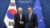 South Korean Foreign Minister Cho Tae-yul, right, shakes hands with European Union foreign policy chief Josep Borrell, at the Foreign Ministry in Seoul, South Korea, Nov. 4, 2024.