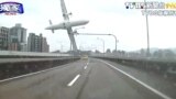This image taken from video provided by TVBS shows a commercial airplane moments before it clipped an elevated roadway and careened into a river in Taipei, Taiwan, Feb. 4, 2015.