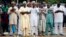 Muslims pray outside a school during celebrations marking Eid al-Adha in Lagos October 15, 2013.