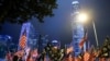 FILE - Protesters hold U.S. flags during a gathering at Edinburgh Place in Hong Kong, China, Nov. 28, 2019. 