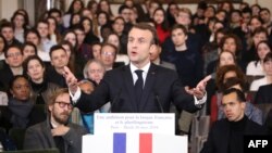 France's President Emmanuel Macron unveils his strategy to promote French as part of the International Francophonie Day before members of the French Academy and other guests at the French Institute, March 20, 2018.